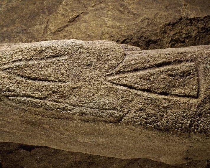 Engraved megalithic symbols on a slab inside the Barnenez cairn