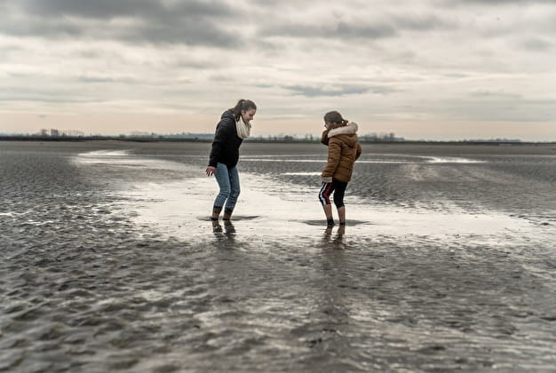 Wet glistening sand in the bay of Mont-Saint-Michel